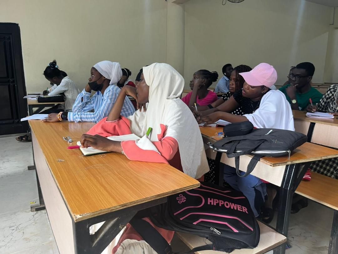 Students seated at long desks during class