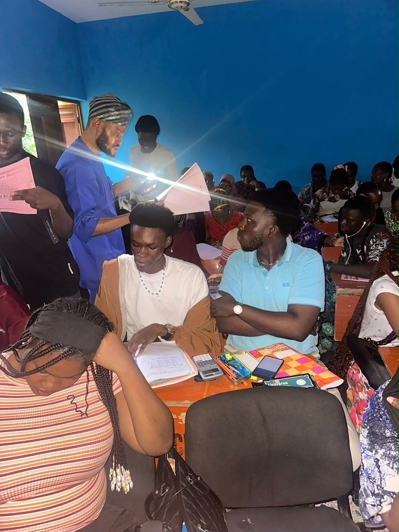 Students working at their desks in a well-lit classroom