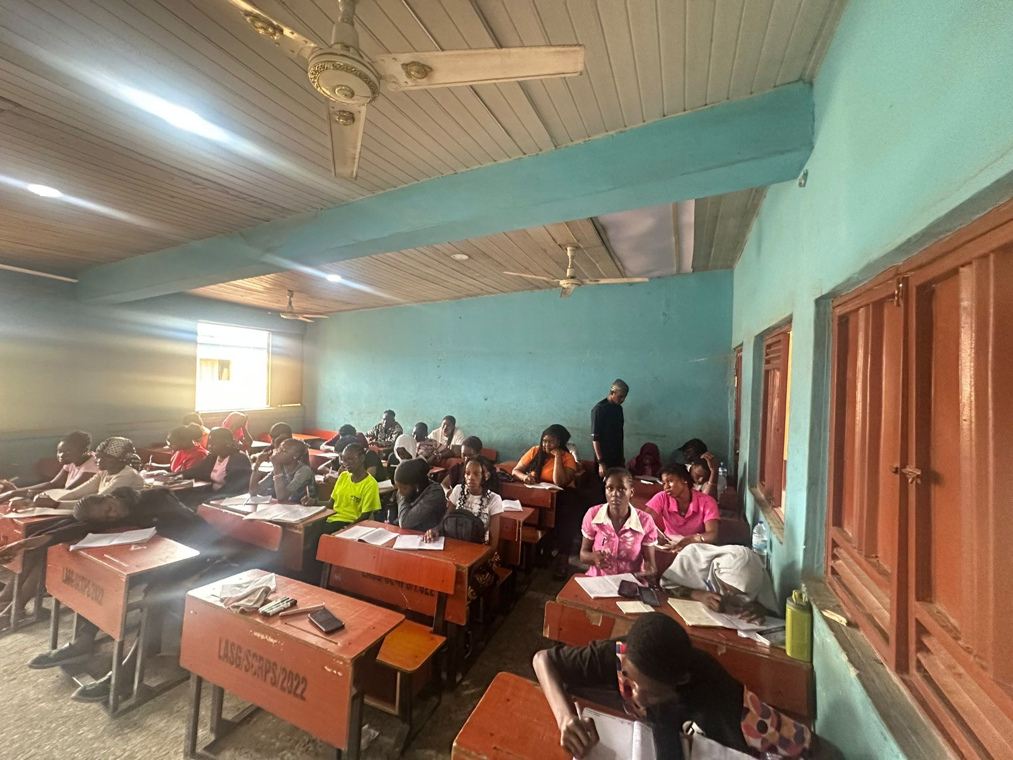 A large BIA JUPEB class at work in a sunlit classroom