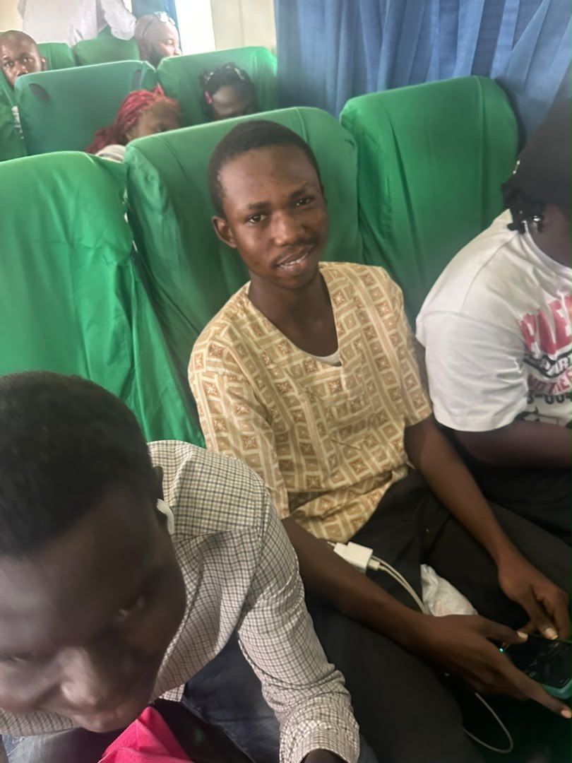 Students seated together on a coach
